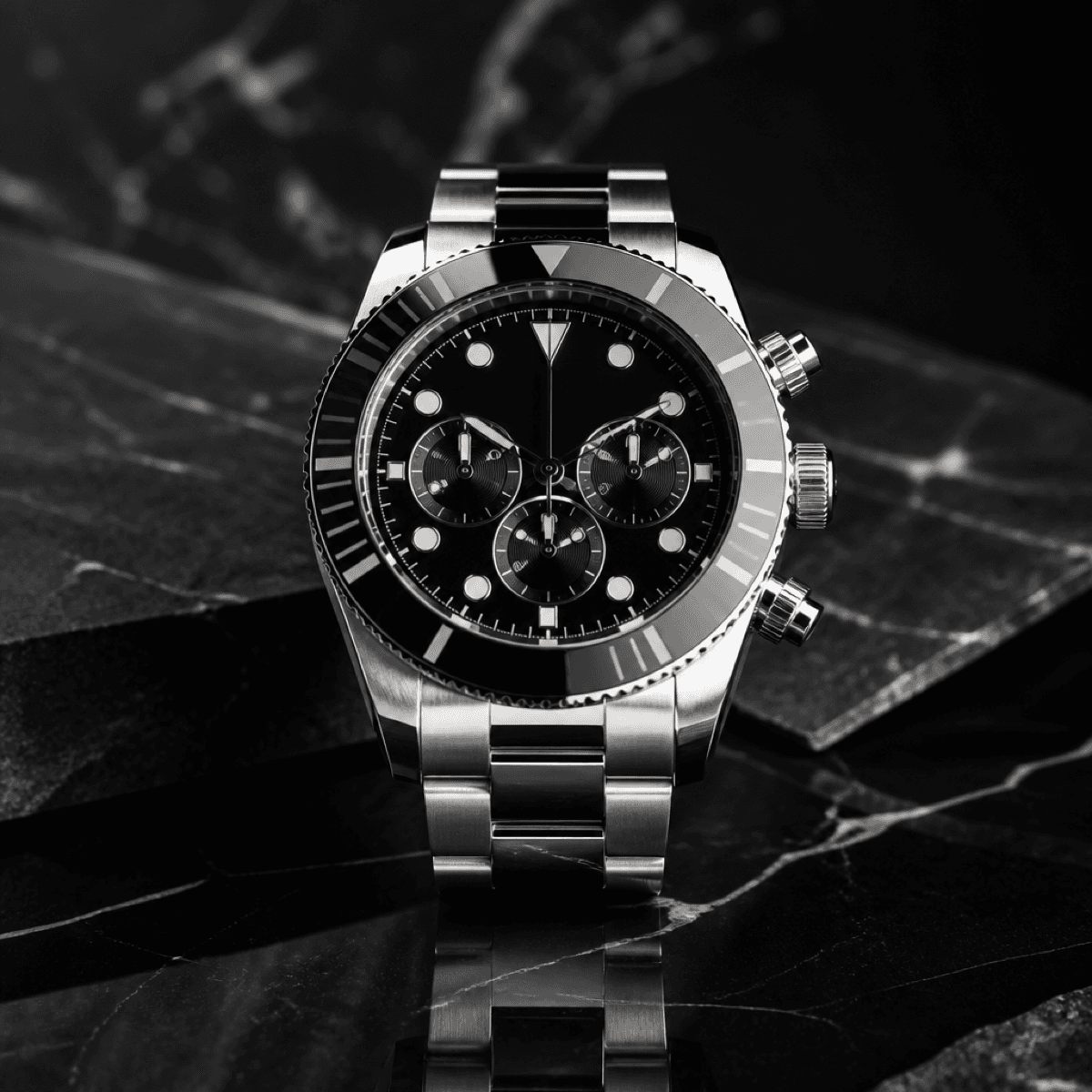 Luxury chronograph watch on a textured surface.