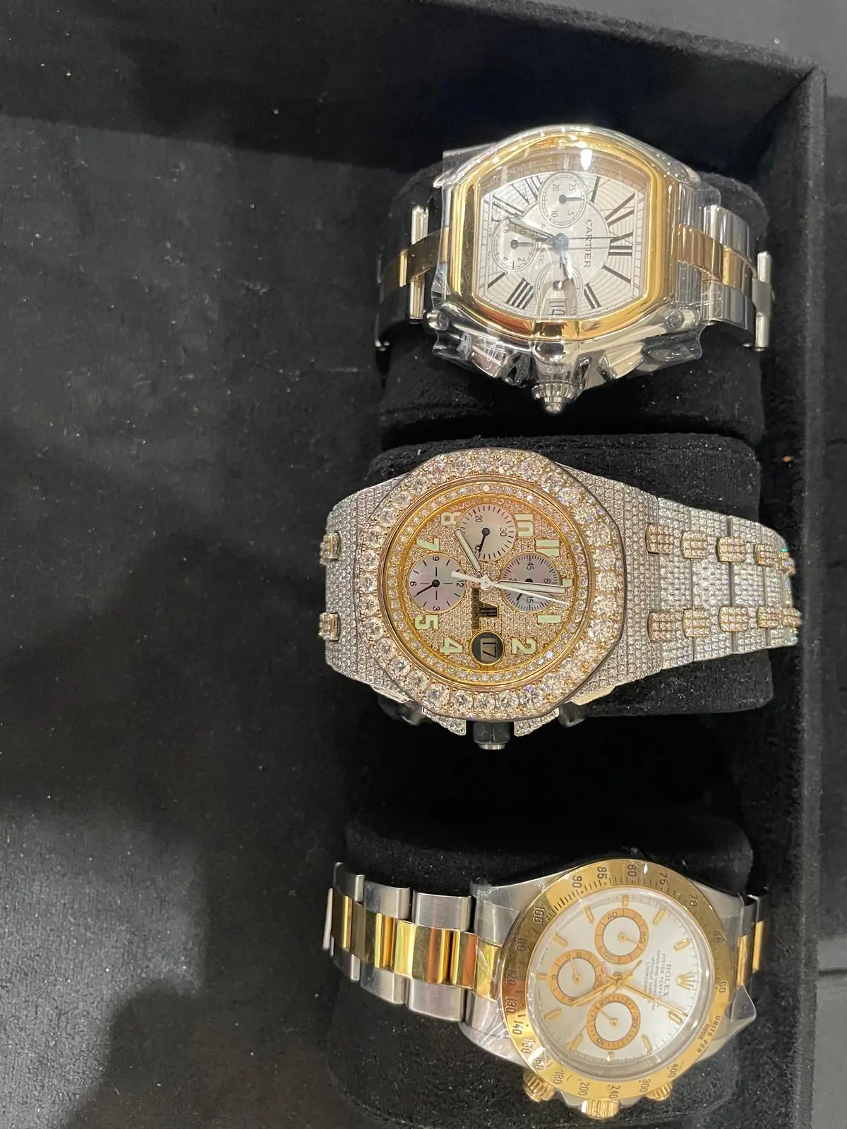 Tray of pre-owned luxury watches at Roma Jewelry in Massapequa.