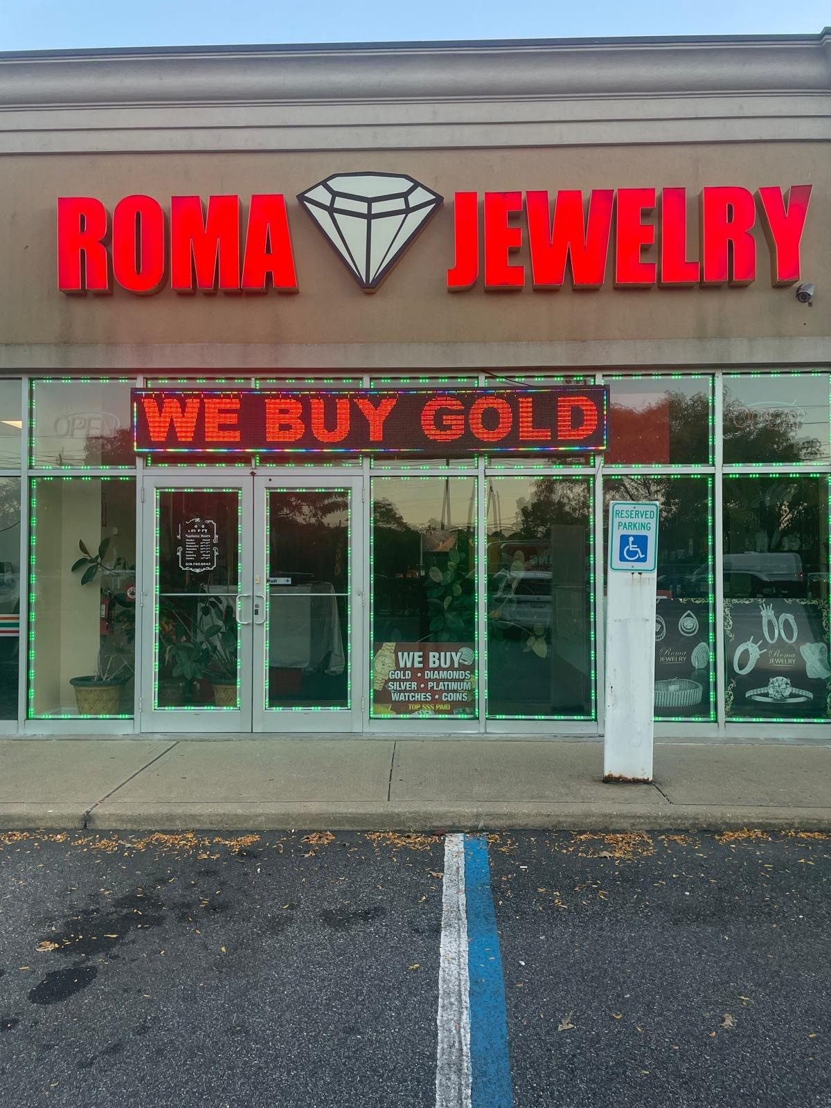 Roma Jewelry storefront at 4222 Sunrise Hwy, Massapequa, with the red Roma Jewelry sign and a We Buy Gold display over the entrance.
